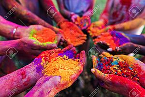 uploader testing-84992245-young-people-holding-colorful-powder-hands-holi-festival.jpg
